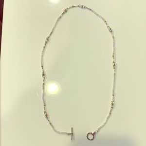 Clear, silver, and opalescent necklace. 21” long.